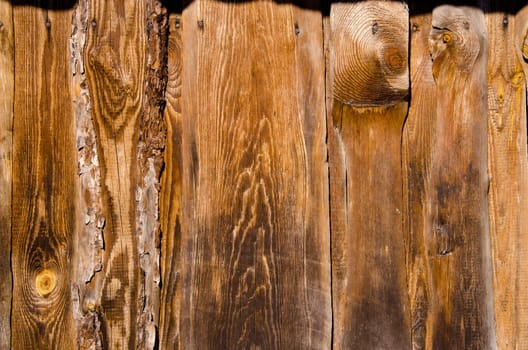 Fragment of old building wall made of wooden planks