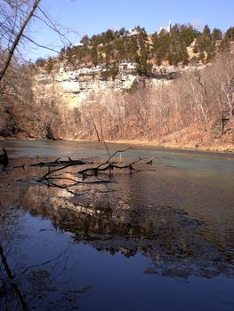 The natural springs at Ha Ha Tonka State Park at the Lake of the Ozarks, Missouri.  The castle ruins can be seen perched atop the limestone bluffs