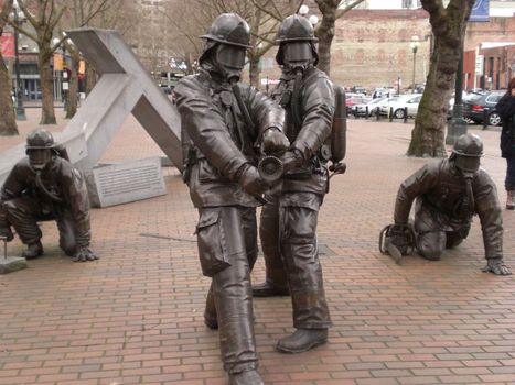Seattle's Fallen Firefighter Memorial statues located in Occidental Park near Pioneer Square