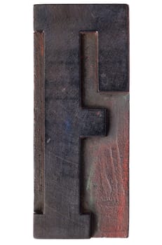 letter F - isolated antique wood letterpress printing  block stained by color inks