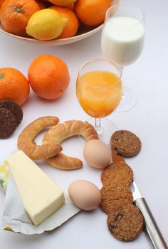 Breakfast with juice, milk, fruits and eggs
