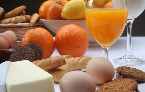 Breakfast with juice, milk, fruits and eggs