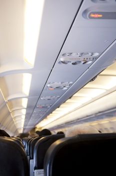 Airplane cabin interior with passengers during the flight