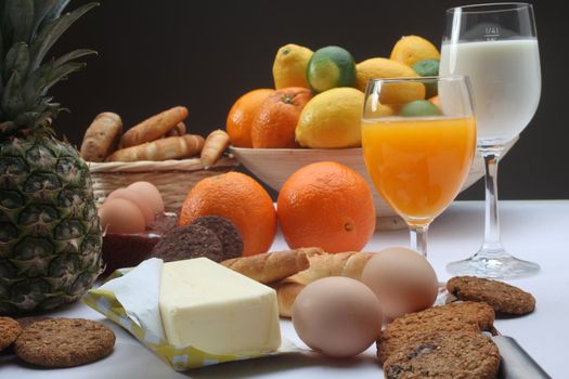 Breakfast with juice, milk, fruits and eggs