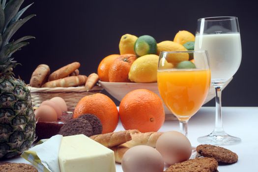 Breakfast with juice, milk, fruits and eggs