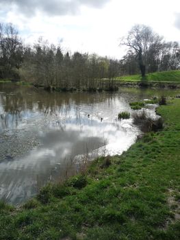 The view of the lakeside landscape in Lydiard Park.
