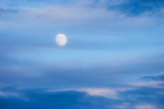 The Moon and clouds at sunset