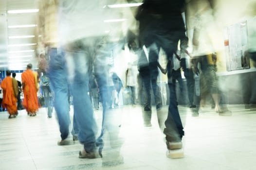 Abstract moving people in subway, motion blurred.