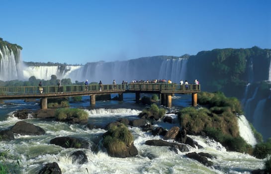 Viewing platform full of people at Iguacu Falls, Brazil.