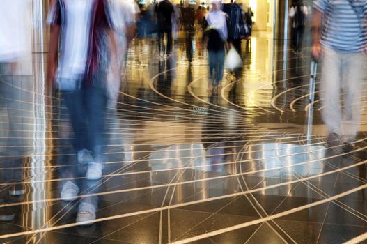 A shopping mall. Long exposure for intentional motion blur of people.