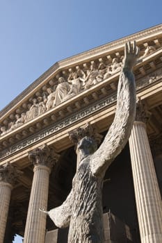 Statue outside La Medelaine. Historic church in the Opera Quarter of Paris, France.