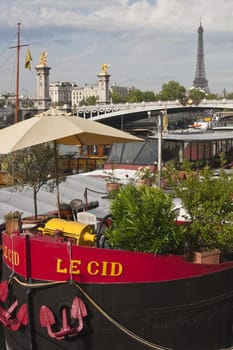 Houseboat tied up to the bank of the River Seine in Paris France