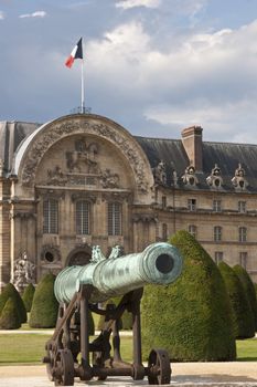 Old cannon in front of the historic Les Invalides in Paris, France.