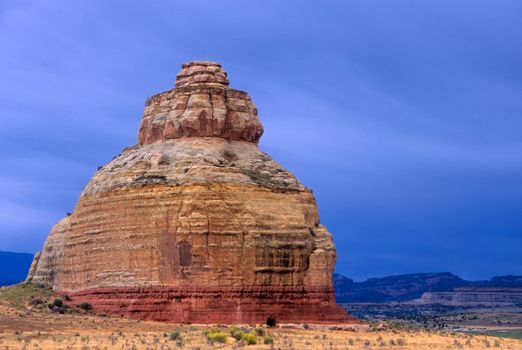 Church Rock and dark skies, Grand County, Utah, USA