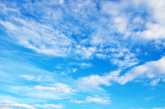 blue sky background with tiny clouds