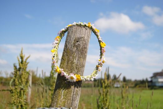 flower garland hanging on fence