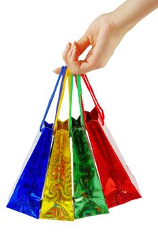 colorful shopping bags set in woman's hand isolated on white