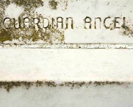 Gravestone with words "Guardian Angel" on it.