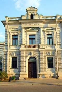 front of old ornate house in Moscow