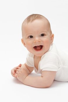 Laughing baby lying on the floor