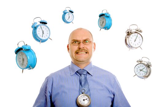 Businessman looking very stressed while various clocks are swirling around his head