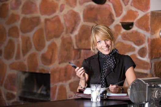 Happy business woman after work in the bar 