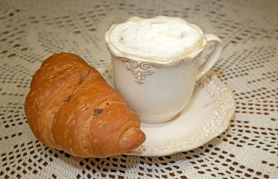 Cappuccino caffee and crispy croissant