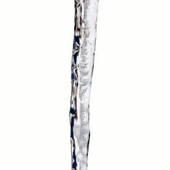 Close view of a icicles with wonderful structures isolated on a white background