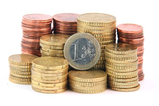 one euro and piles of euro coins isolated on white background money and finance concepts