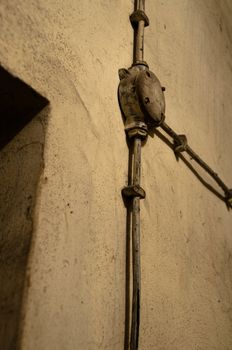 Old electric equipment mounted on cellar wall