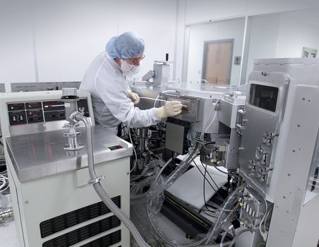 Operator checking for vacuum leaks in electronic equipment