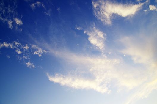 blue sky background with tiny clouds