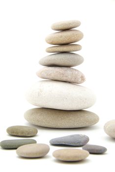 Stack of balanced stones on a white background