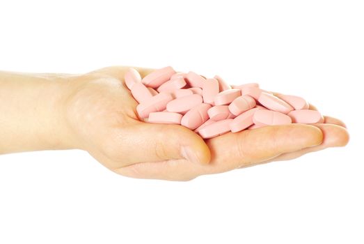  hand holds pills isolated on white