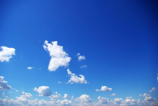 blue sky background with tiny clouds