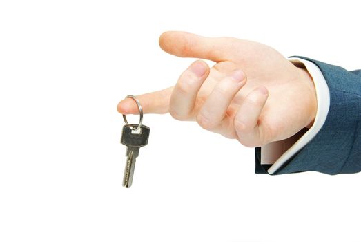 hand holds a key isolated on white