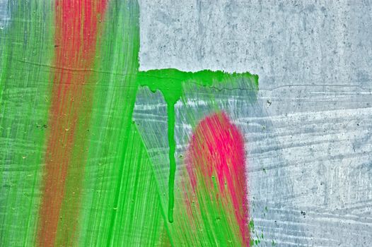 Weathered metal surface with abstract paint strokes.