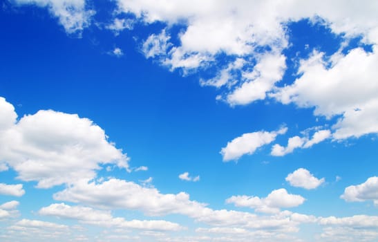 blue sky background with tiny clouds