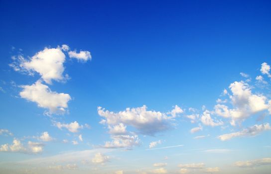 blue sky background with tiny clouds