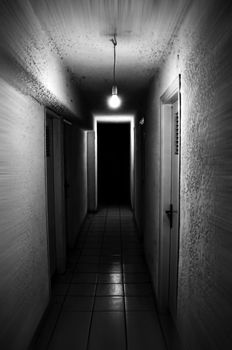Light shining in dark basement corridor. Motion blur.