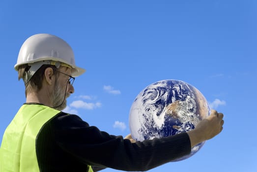 the earth in a worker hands