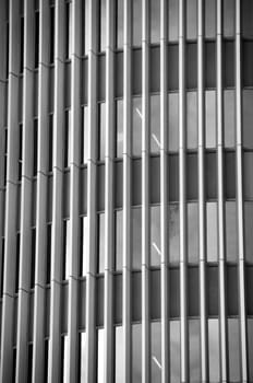 Glass facade of a modern office building. Black and white.