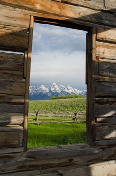 View of the Teton Mountain Range from an old miner's cabin, Grand Teton National Park, Teton County, Wyoming, USA