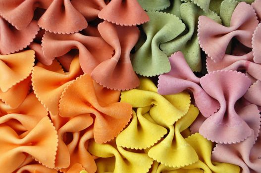 Italian farfalle pasta flavors. Creative food background.