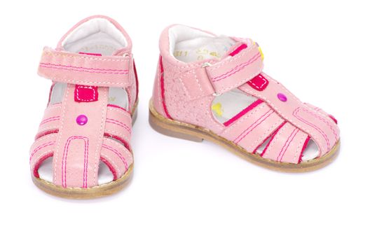 pink child's sandals isolated on white