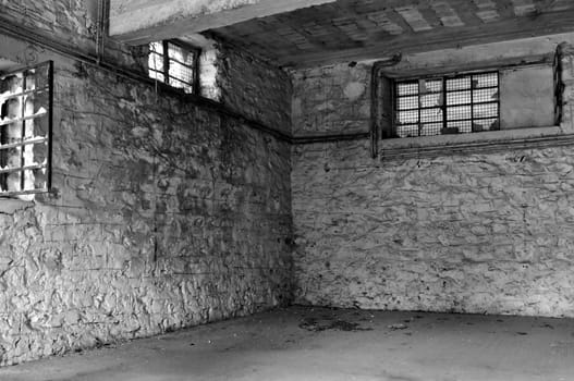 Empty industrial room and textured white wall. Abandoned warehouse interior.