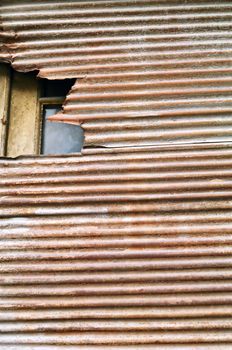 Weathered rusty roll down corrugated metal shutter texture.