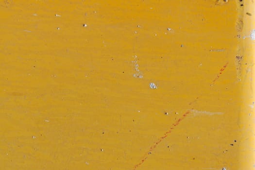 Yellow painted metal background. Grungy industrial texture.