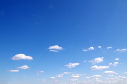 blue sky background with tiny clouds