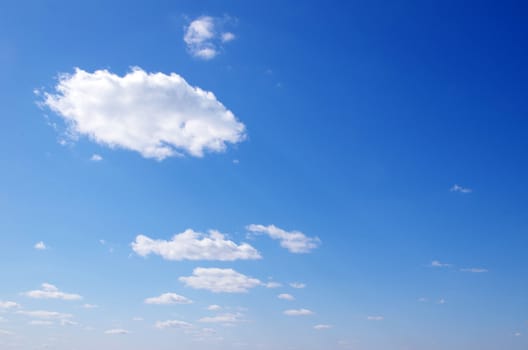 blue sky background with tiny clouds